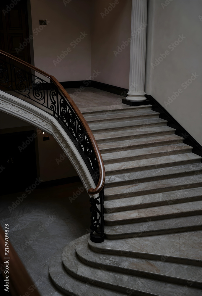Obraz premium Luxury architecture and interior design, grand marble staircase with ornate wrought iron railing in a classic historic building hallway