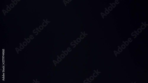 Lens Flare, Abstract Bokeh flares Lights Moving. Leaking Reflection of a Glass, Crystal, Defocused Shining Colorful rainbow Light Leaks, Rays on Black Background. 
