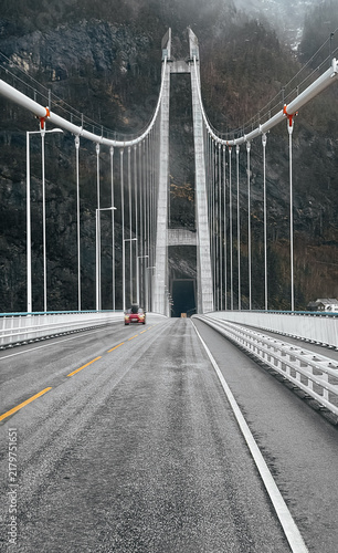 Symmetrical low angle view of the dramatic Hardanger Bridge in Norway