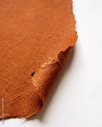 Handmade Terracotta Textured Paper Sheet With Torn Edges and Natural Fibers for Artistic Crafting and Design Background