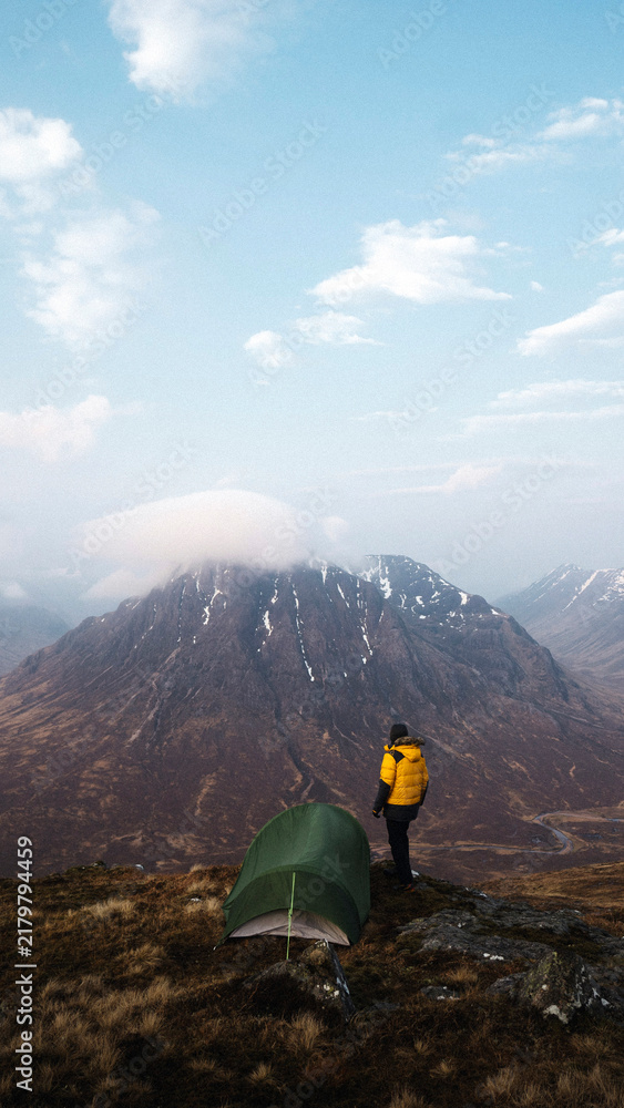 Obraz premium Adventure phone wallpaper background, camping at a misty Glen Coe, Scotland