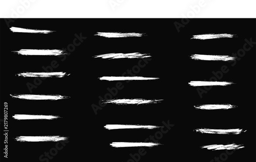 Collection of textured white paint brush strokes isolated on black background editing show swatches