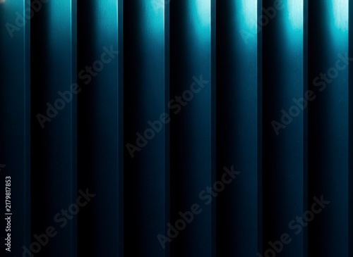Abstract background of vertical teal and dark blue stripes with light and shadow