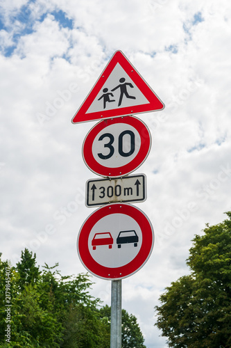 Konstfotografi German traffic signs warning of children crossing, speed limit and no overtaking
