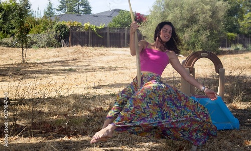 Woman Enjoying Rope Swing Outdoors