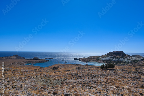Panoramic coastal landscape with hilltop village and fortress at Lindos, Rhodos, Greece