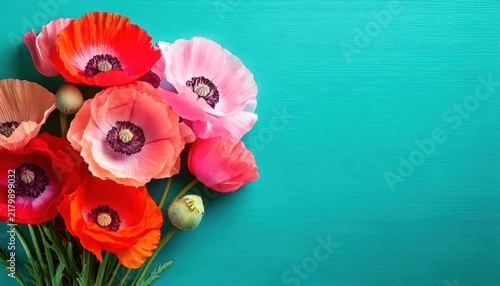 Vibrant Pink and Red Iceland Poppies Bouquet Against Bright Turquoise Background