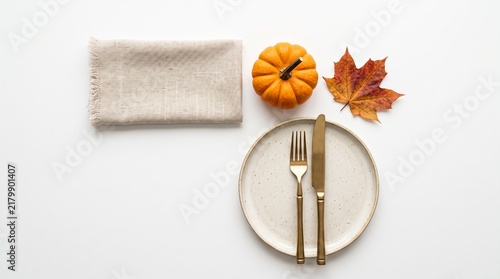 autumn fall table setting place dinner plate fork knife cutlery silverware napkin linen pumpkin leaf leaves orange yellow brown white background seasonal on transparent background