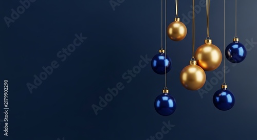 Golden and blue shiny christmas baubles hanging from gold ribbons
