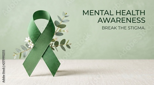 Green ribbon for mental health awareness with eucalyptus branches and white flowers for website banner background.