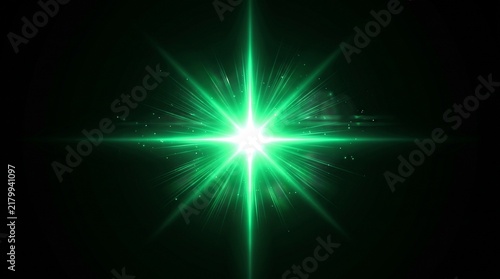 Bright green star light flare on black background