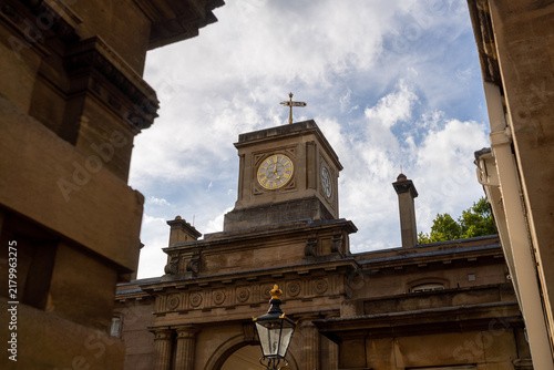 Sticker Historic Clock Tower silhouetted against cloudy sky with architectural details a