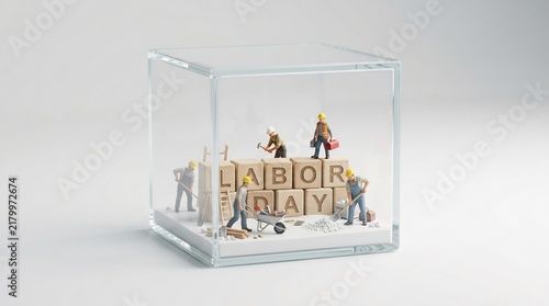 Miniature construction workers building Labor Day message with wooden blocks inside a clear glass cube, creative workforce appreciation concept, career celebration diorama.