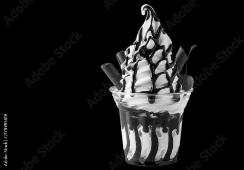 Vanilla soft serve ice cream cup with chocolate syrup isolated on transparent background