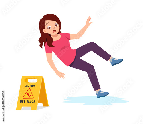 Canvas Print Young woman with a startled expression falling on a wet floor near a caution sig
