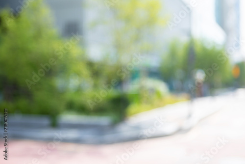 Canvas Print Abstract blurred modern downtown public plaza background with a building frontag