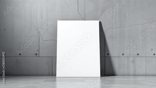 Blank white vertical canvas frame leaning against a textured gray concrete wall in a modern room