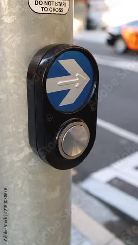 close-up of a pedestrian crossing button in a city