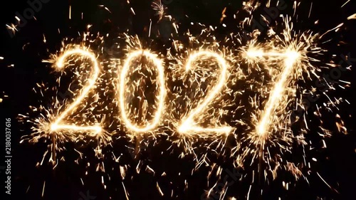 Sparkler firework forming year 2027 number with golden sparks on black on transparent background