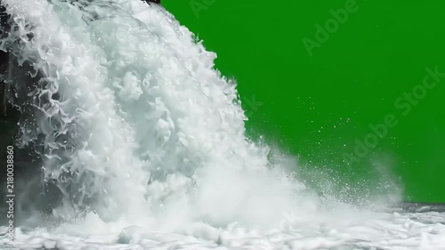 Waterfall water flow over rocks against a green screen background on transparent background