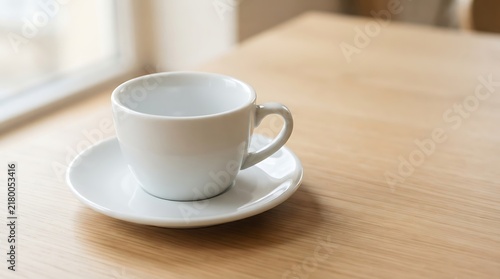 Clean Empty White Ceramic Coffee Cup on Wooden Table