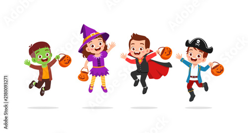 Four happy children jumping in fun Halloween costumes holding pumpkin candy buckets with joyful expressions