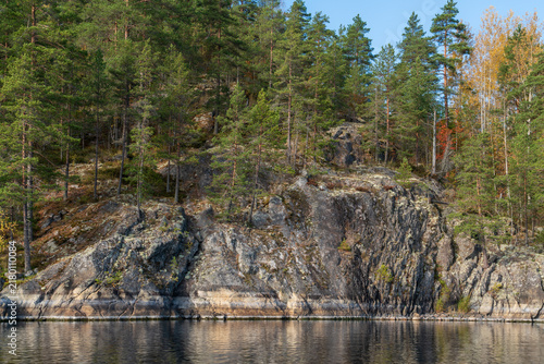 Принти на полотні Rocky shores of Lake Ladoga near the village of Lumivaara on a sunny autumn day,