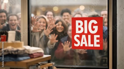  Busy store window scene: shoppers behind glass reacting to a Big Sale sign, smiling, pointing, and waving as bargains beckon; a dynamic, candid portrait of retail excitement and anticipation during a