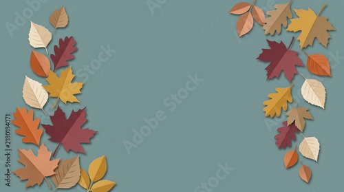 Autumn leaves framing a blank space on a muted teal background for design