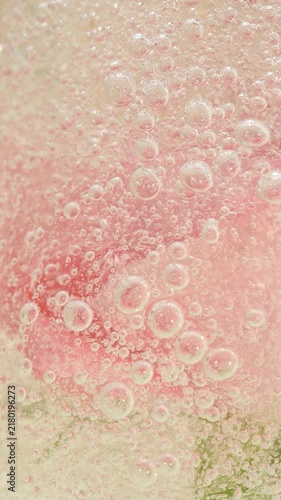Vertical pink serum gel background, cream, shampoo, soap bubbles, foam texture