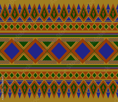 Repetitive ethnic geometric tribal weaving and embroidery pattern with blue, terracotta orange, and dark green on a mustard yellow background.