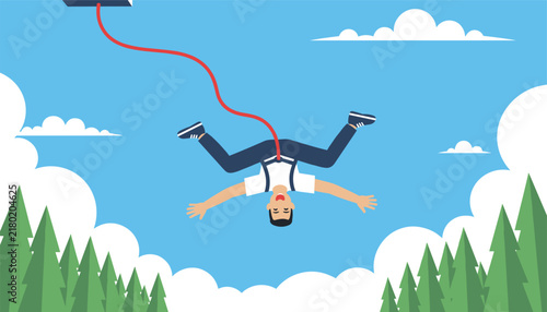 Brave young man enjoying a bungee jumping extreme sport experience, diving headfirst down into the beautiful green forest.