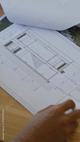 Architectural drawings and technical plans with detailed building layouts, measurements and construction documentation for a real estate development project.