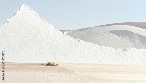 Surreal desert landscape with white sand dunes and a lone figure.