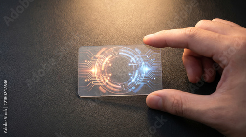 Close-Up of Hand Touching Futuristic Digital Circuitry on Transparent Card