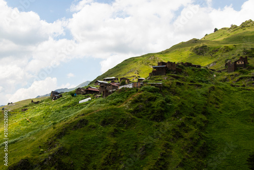 A striking view of the historic village of Chigo, perched dramatically on the steep mountain slopes of Tusheti