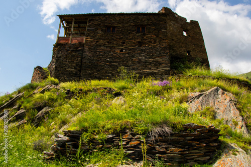 A striking view of the historic village of Chigo, perched dramatically on the steep mountain slopes of Tusheti