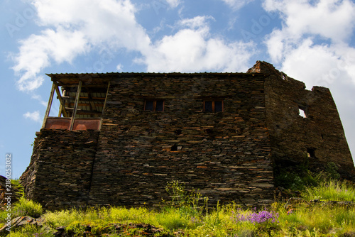 A striking view of the historic village of Chigo, perched dramatically on the steep mountain slopes of Tusheti