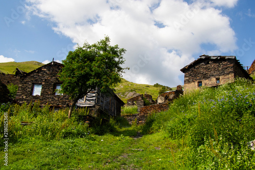 A striking view of the historic village of Chigo, perched dramatically on the steep mountain slopes of Tusheti