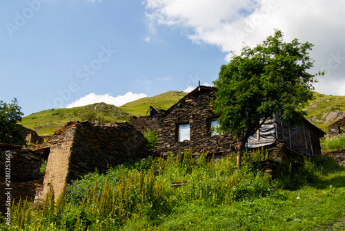 A striking view of the historic village of Chigo, perched dramatically on the steep mountain slopes of Tusheti