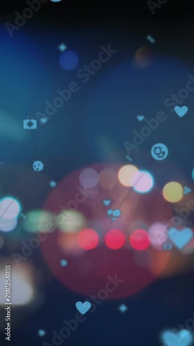 Animation of lens flares and multiple medical icons over blurred vehicles moving on street in city