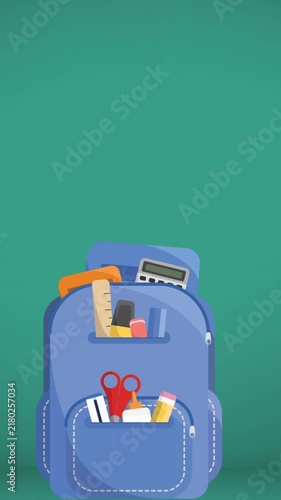Multiple school items floating into school bag against copy space on green background