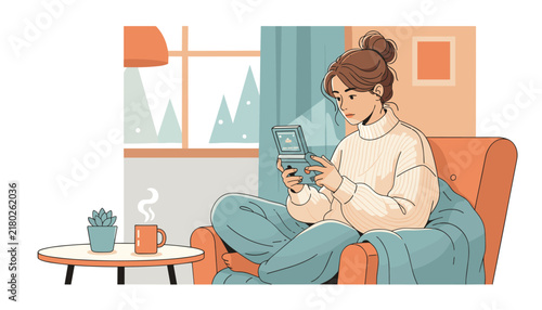 Cozy young woman sitting in a comfortable armchair, playing on a retro handheld game console with hot tea.