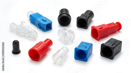 Colorful assortment of plastic connectors and caps on a white background