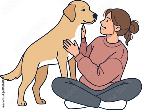 Happy young woman sitting on the floor and petting her friendly golden retriever dog