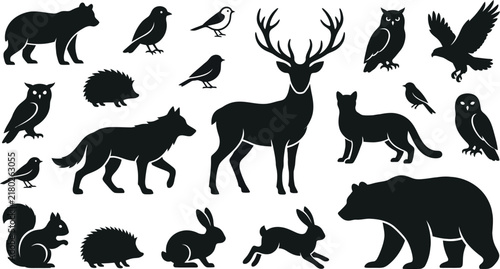 Collection of wild forest animal silhouettes including deer bear wolf owl and birds isolated on a transparent background