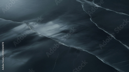 Dark marble texture with white veins presents a dramatic moody surface