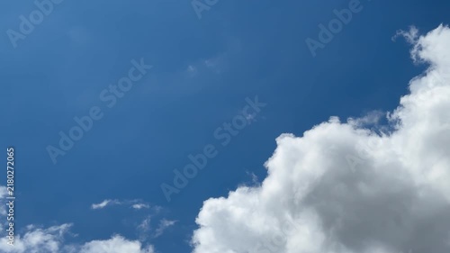 Drifting White Cumulus Clouds in Deep Blue Sky with Wide Copy Space