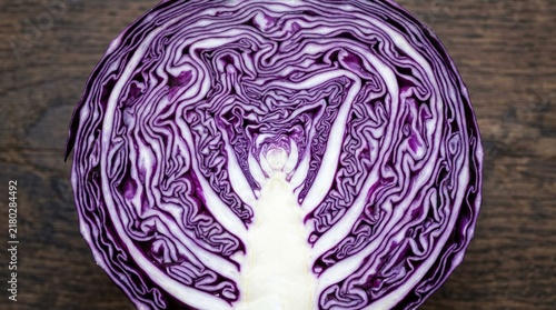 Half of a Fresh Organic Red Cabbage on a Wooden Background.