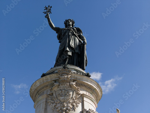 Fotografie Marianne statue standing against a clear blue sky, symbolizing French liberty an